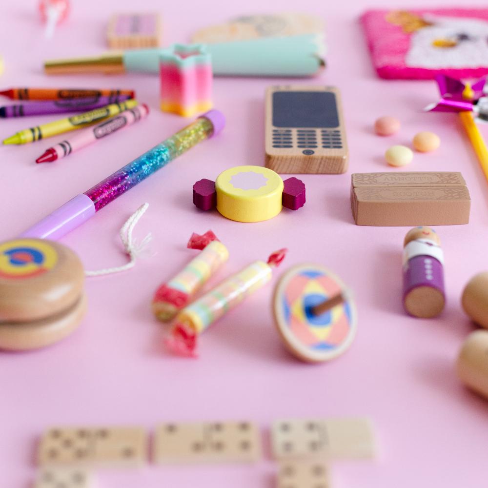 Make Me Iconic Wooden Toy Phone from the Loose Change Range, featuring a realistic design for pretend selfies, texting, and calls. Encourages imaginative, screen-free play for kids who love to copy the grown-ups.