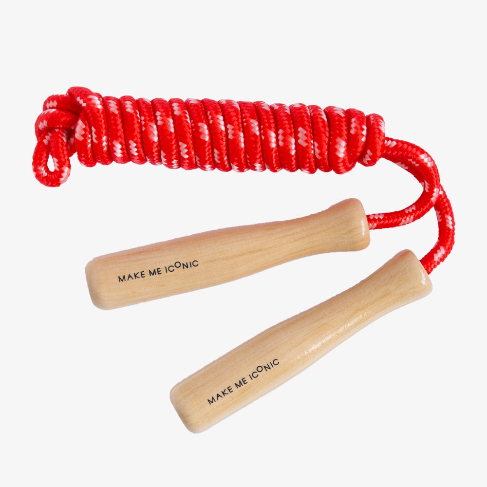 Wooden skipping rope with smooth natural handles and neutral-coloured rope, designed for active play, coordination, and classic childhood fun.