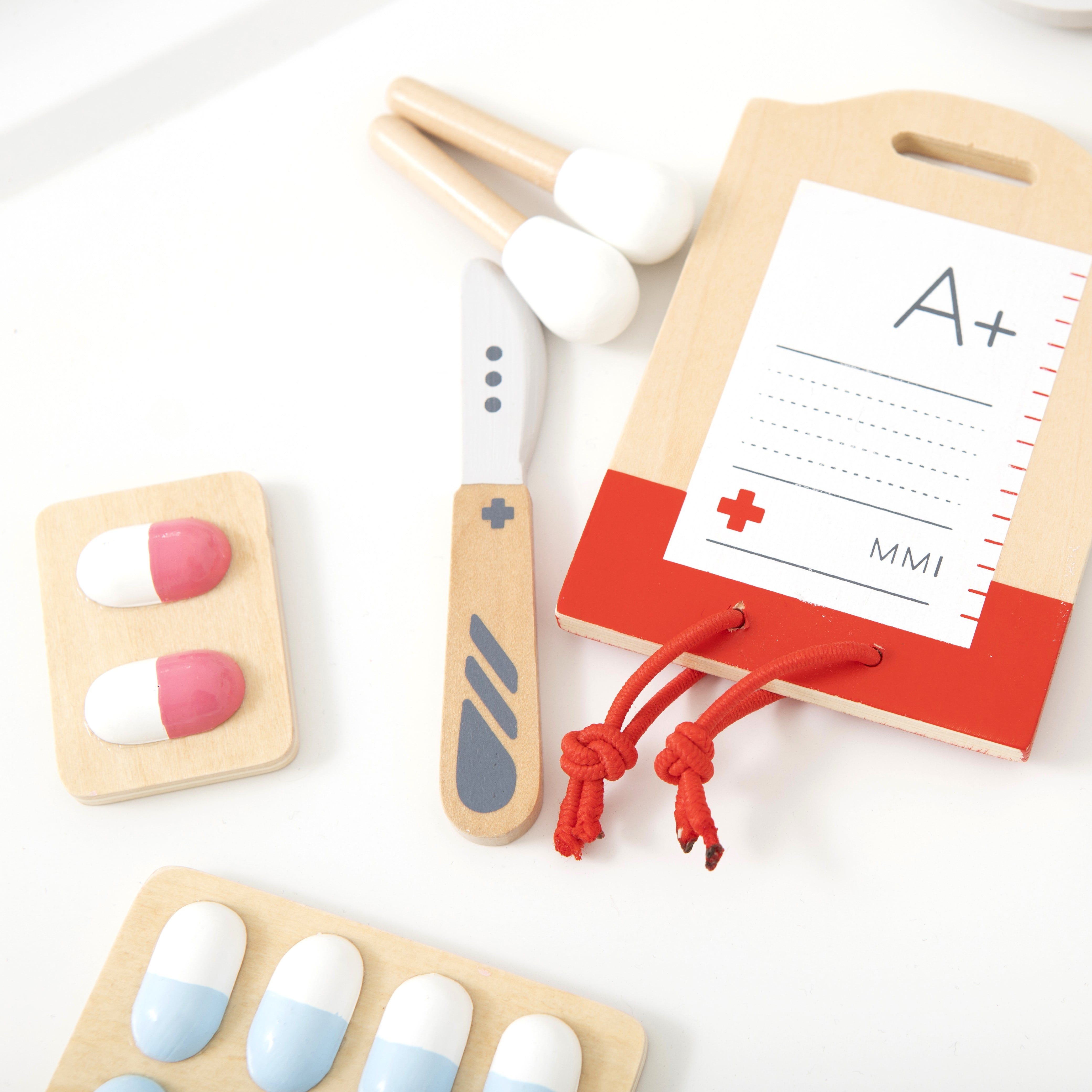Wooden Toy Surgeon Kit with realistic medical instruments, designed to complement the Doctor’s Kit for advanced pretend play and role play fun.