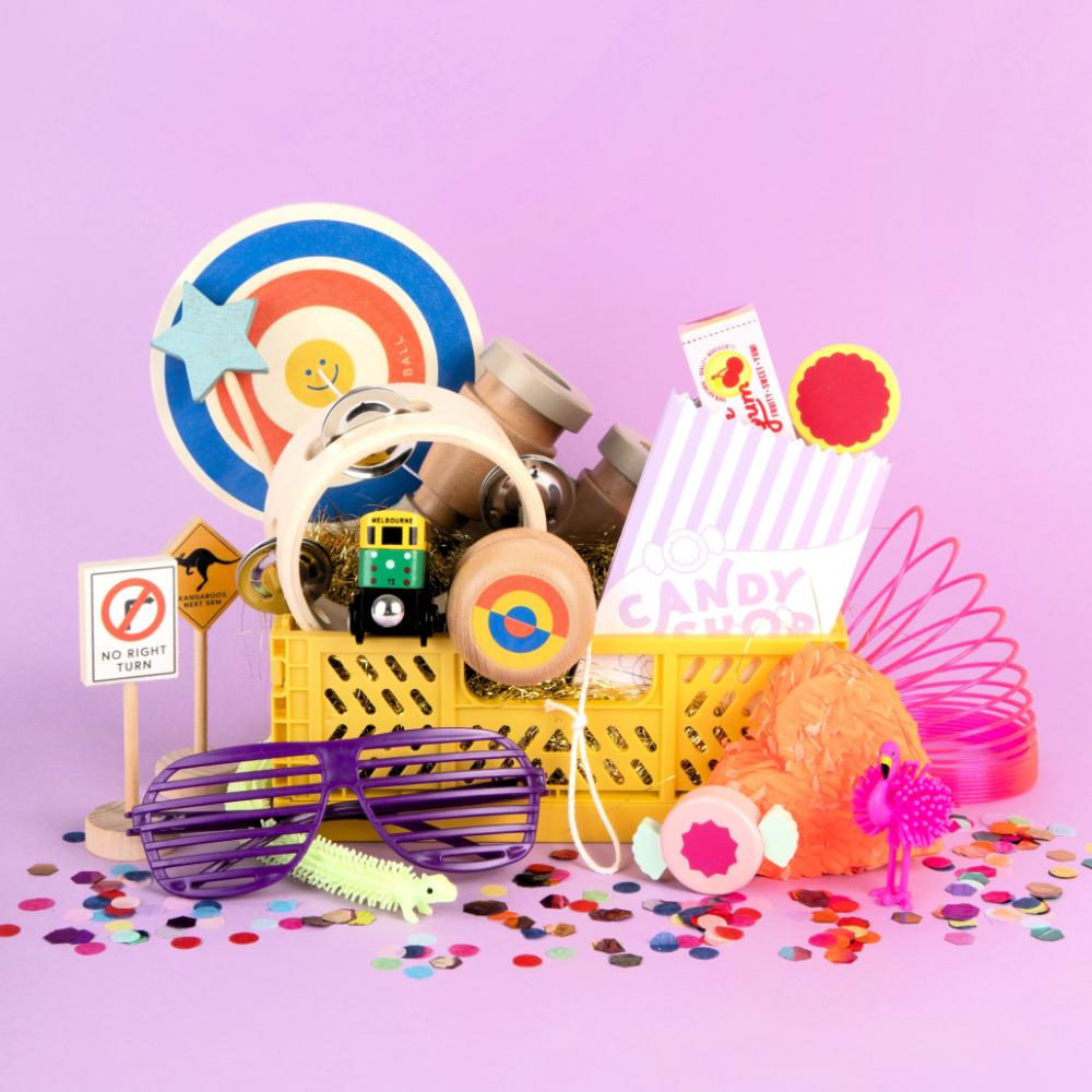 Make Me Iconic 1-piece wooden toy tambourine with a classic round design, perfect for musical pretend play. Encourages young kids to explore rhythm, coordination, and creative expression through music.