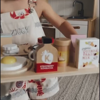 Make Me Iconic wooden Healthy Tummy Brekkie or Breakfast Tray featuring toy avocado toast, kombucha, almond milk, goat's cheese, and tahini spread. A 21-piece wooden breakfast play set inspired by Aussie café culture, perfect for pretend play, creativity, and healthy food learning.