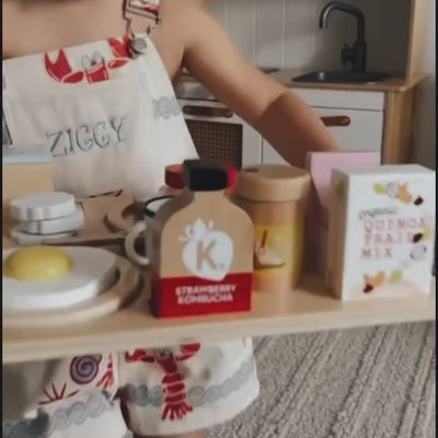 Make Me Iconic wooden Healthy Tummy Brekkie or Breakfast Tray featuring toy avocado toast, kombucha, almond milk, goat's cheese, and tahini spread. A 21-piece wooden breakfast play set inspired by Aussie café culture, perfect for pretend play, creativity, and healthy food learning.