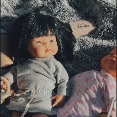 Make Me Iconic set of 3 wooden toy doll rusks in a cardboard box, designed for pretend feeding and nurturing role-play. Perfect for developing empathy, fine motor skills, and imaginative play in young children.