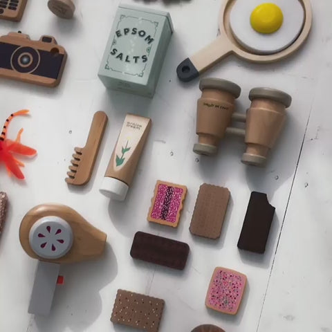 Make Me Iconic wooden toy camera for kids with a real viewfinder and a pressable button, designed for imaginative pretend play and creative role-play photography fun.